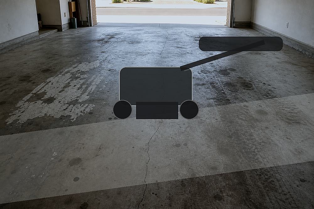 Diamond grinder prepping a bare concrete garage floor before coating